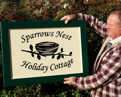 Lee with a Painted Framed Sign