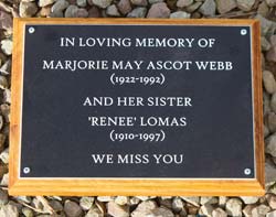 Plaque on a wooden backing board. Plaque on a wooden backing board.