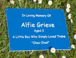 Blue laminate memorial with white text. Blue laminate memorial with white text.