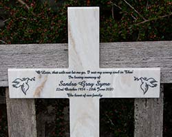 Engraved corian memorial cross.