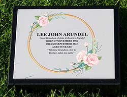 Full colour memorial plaque on black granite wedge. Full colour memorial plaque on black granite wedge.
