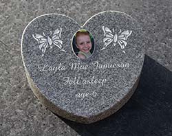 Celtic grey heart shaped wedge with porcelain plaque attached.