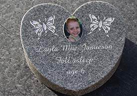 Celtic grey granite heart memorial tablet with a porcelain photo.