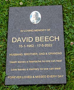 Porcelain plaque inset into granite.