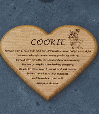 Heart shaped wooden memorial plaque.