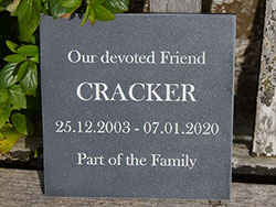 Engraved stone-like corian memorial plaque. Engraved stone-like corian memorial plaque.