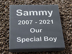 Square slate pet memorial.