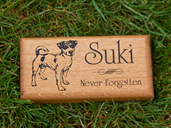 Wooden memorial with a dog image.