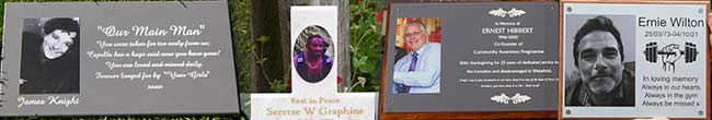 Photos on memorial plaques.
