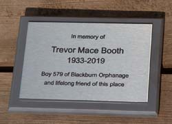 Laser engraved memorial plaque on slate corian backing board.