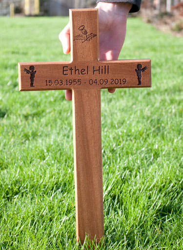 Engraved wooden memorial cross.