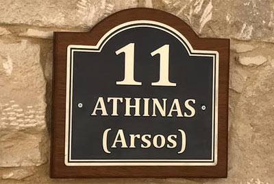 Zinc plated house sign with a backing board