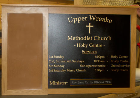 Wooden notice board with information panel.