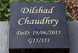 Black granite wedge with gold text. Black granite wedge with gold text.