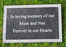 Black granite memorial plaque with a sand blasted border. Black granite memorial plaque with a sand blasted border.