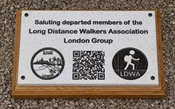 Stone-like corian plaque on a wooden backing board. Stone-like corian plaque on a wooden backing board.