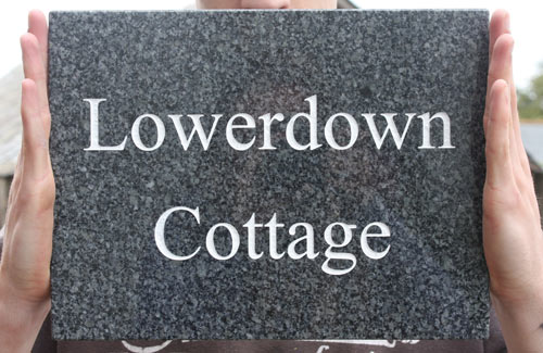 Classic dark grey granite name plate.