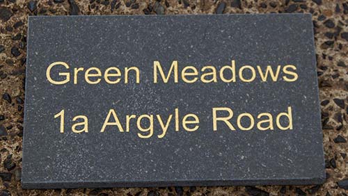 Granite address sign - gold text.