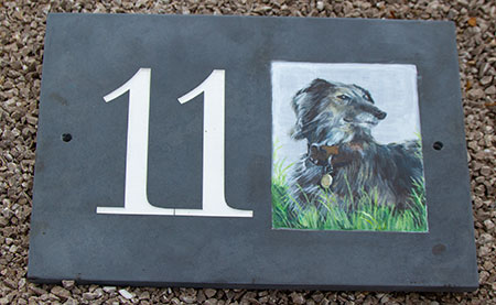 Your pet and painted onto a slate sign.