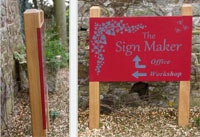 Slate sign inset into oak posts.