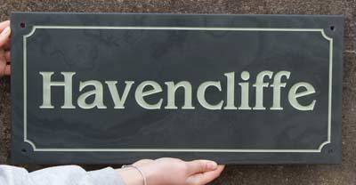 Slate sign with line border with indented corners Slate sign with line border with indented corners