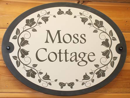 Reverse painted slate house sign - font Footlight MT Light - flower border