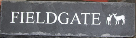Rustic slate house sign with an image