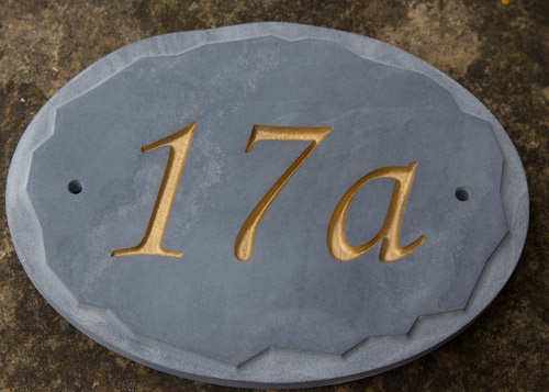 Slate number with rough edged sign