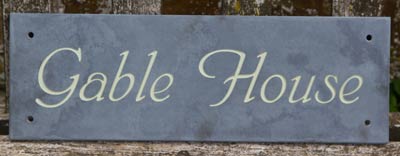 Slate house signs painted in many colours
