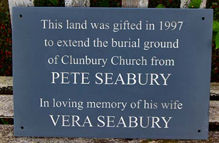 Memorial plaque with holes drilled.