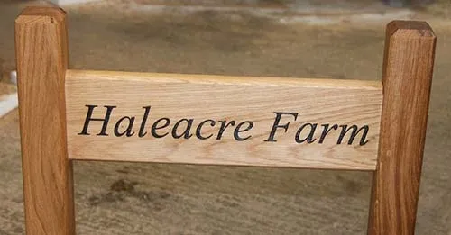 The oak sign has been morticed into the oak posts. Natural Oak Entrance Sign