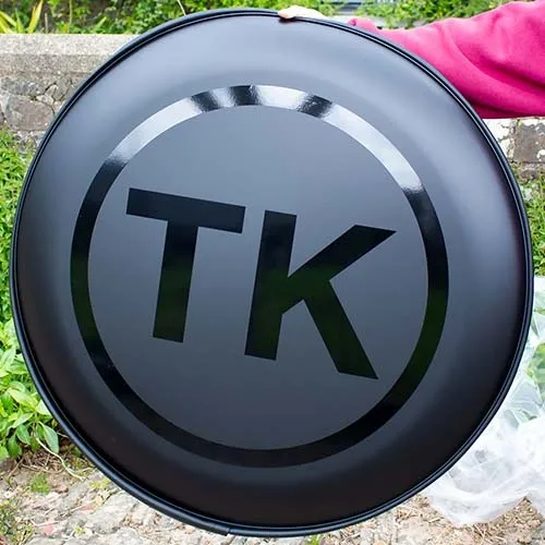 Black gloss text on a matt black wheel cover. Stylish Personalised Wheel Cover