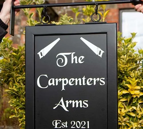 Traditional hanging sign on a wrought iron bracket. Tradional Hanging Sign - Double Sided