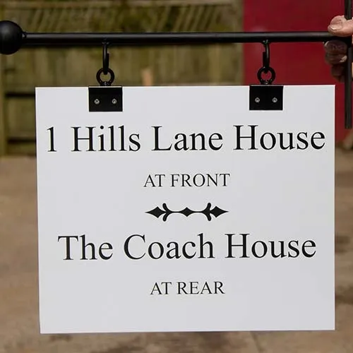 The suspension brackets fit the sign to a wrought iron bracket. Hanging Aluminium Sign