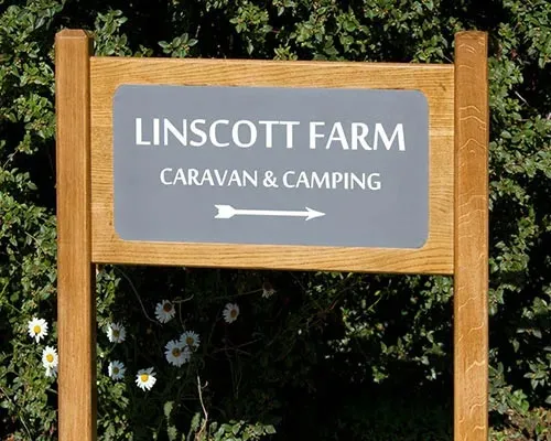 Engraved corian plaque inset into solid oak. Engraved Corian House Sign Inlaid into Oak