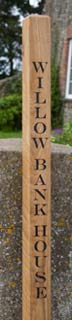 Oak gate posts sign