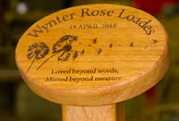 Oval wooden plaque on a post Oval wooden plaque on a post