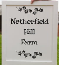 Black and whited painted framed sign Black and whited painted framed sign
