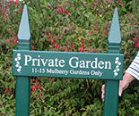 Painted wooden sign on posts. Painted wooden sign on posts.