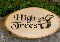 Rustic wooden sign with squirrel image.