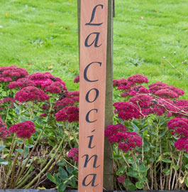 Sapele gate post sign.