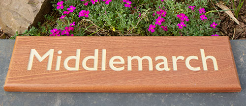 Wooden house sign made in dapele wood.
