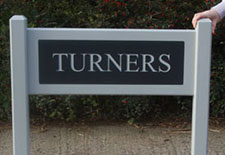 Painted hardwood sign with engraved corian insert Painted hardwood sign with engraved corian insert