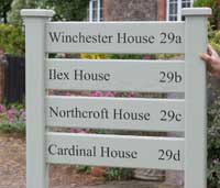 Painted hardwood ladder sign. Painted hardwood ladder sign.